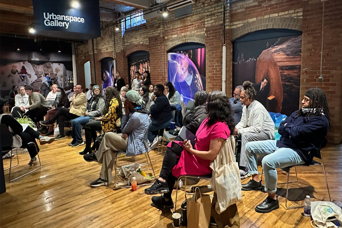 Group of people gathering for a presentation.